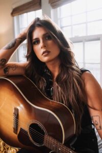 Ella Langley portrait with a guitar